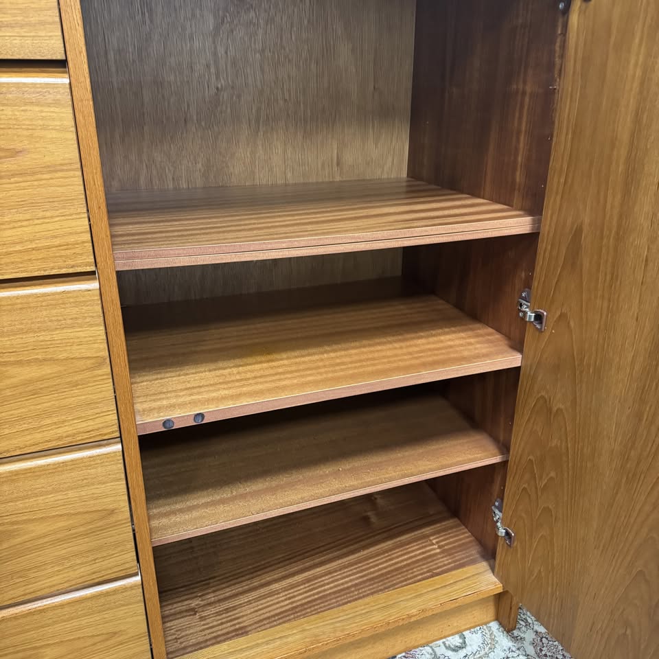 Close up view of shelves on right side of Danish teak MCM cabinet and dresser