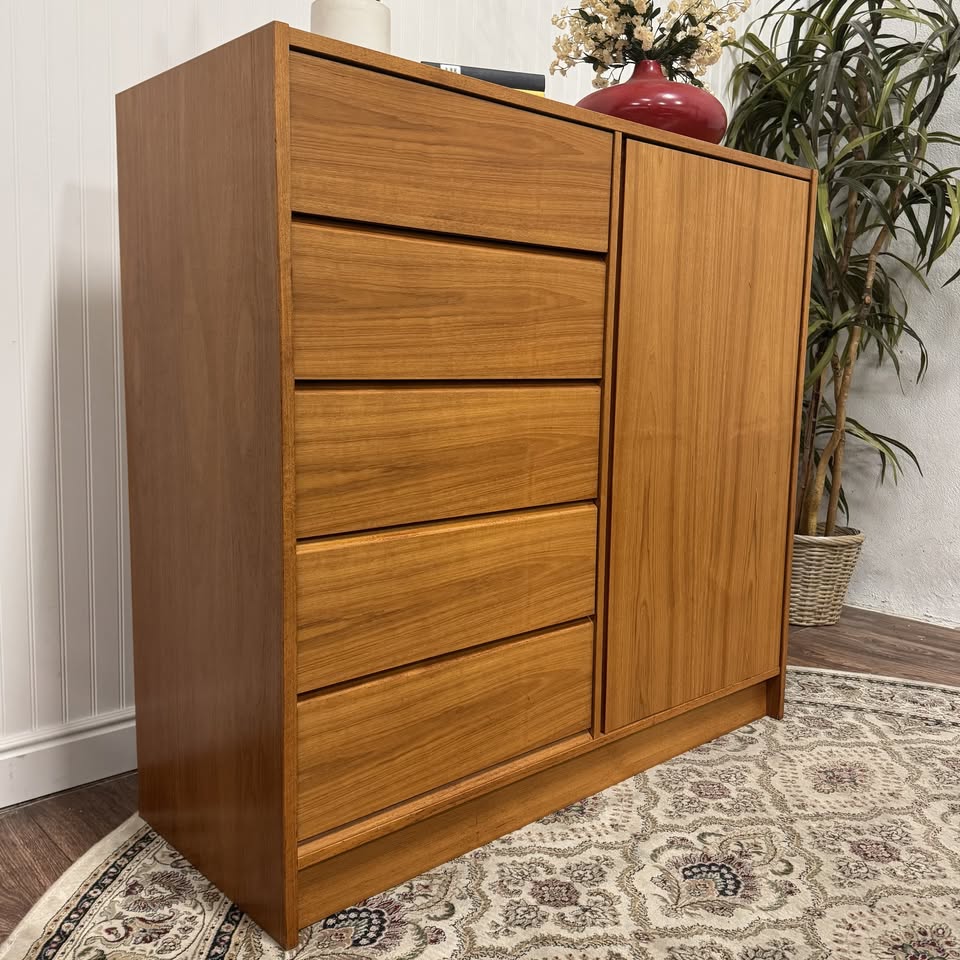 Angled view of Danish mid-century modern teak dresser and linen and press