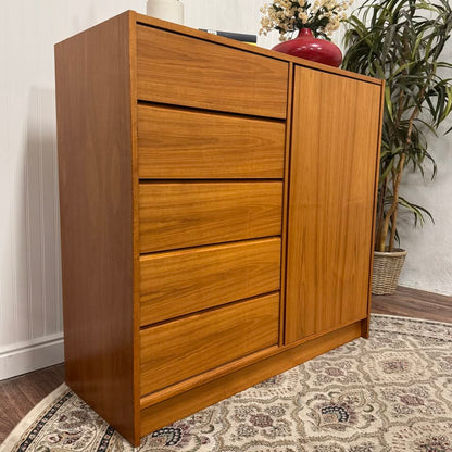 Angled view of Danish mid-century modern teak dresser and linen and press