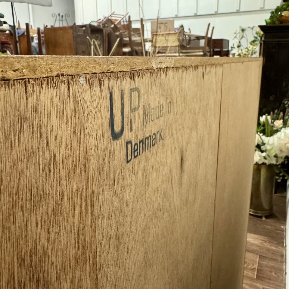 Close up view of back of Danish teak MCM Dresser showing UP brand mark and "Made in Denmark"