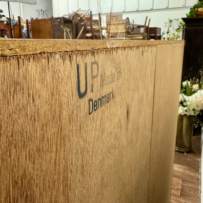 Close up view of back of Danish teak MCM Dresser showing UP brand mark and "Made in Denmark"