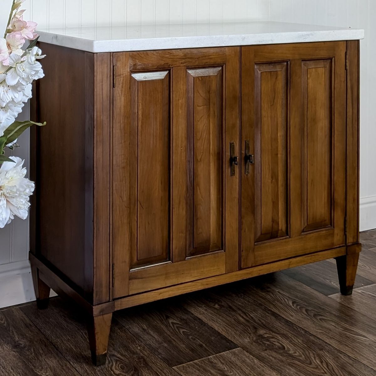 Angled view of Brandt Mid Century Marble Top Cabinet